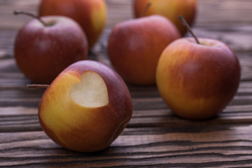 red apples on wooden table, selective focus