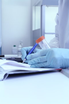 Laboratory Technician Write Test Results From Lab