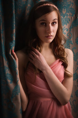 Obraz premium Beautiful young girl in the vintage interior