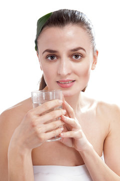 Smiling happy woman holding the glass of water.