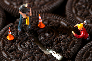 Construction Workers in Conceptual Imagery With Cookies