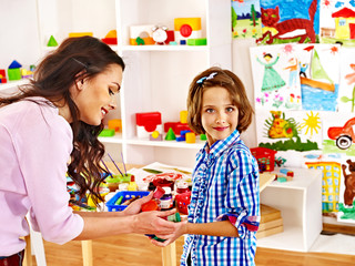Naklejka premium Family with child playing bricks.