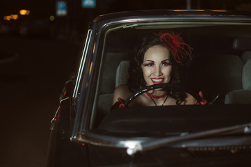 Fototapeta na wymiar Young sexy woman sitting in car