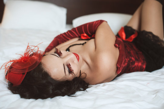 Beautiful sexy woman lying on bed