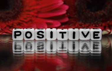 Positive text with red flowers