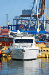 White motor yacht over harbor pier, Odessa, Ukraine