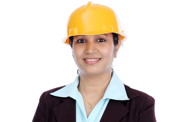 Happy businesswoman in white helmet with crossed arms