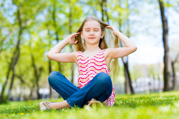 portrait of a smiling girl in a park