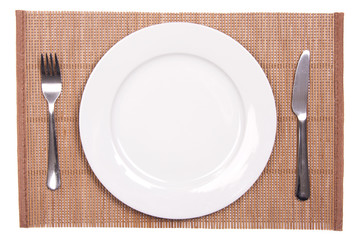 White plate on a bamboo mat