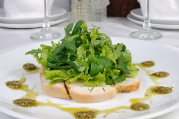 Slices of roasted chicken with lettuce