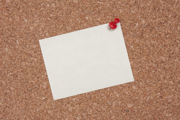 Post it note on cork board