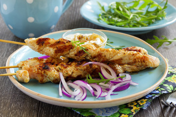 Barbecue beef skewers with sauce.