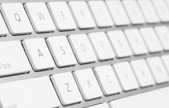close up of a white keyboard english alphabet