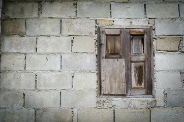 background of old brick wall with vintage window