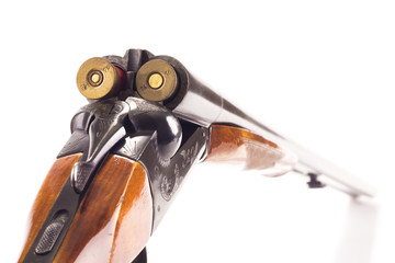 Opened double-barrelled hunting gun with two cartridges
