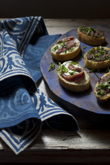 canapes with anchovies and olive paste with parsley