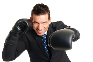 Handsome man in suit with boxing gloves on his hands
