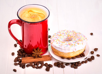 Tasty donut with a cup of coffee