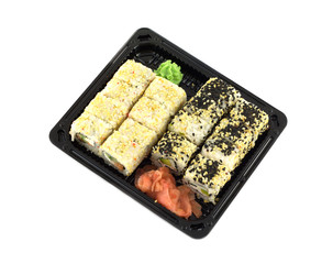 Sushi rolls in plastic container isolated on white closeup