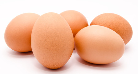 Brown chicken eggs isolated on a white background closeup