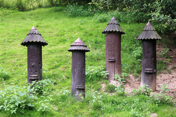 Old fashioned beehives in the woods.