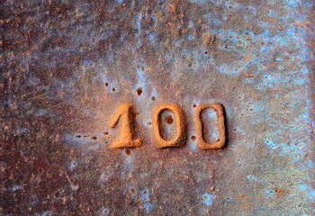Detail of old railway track with number one hundred on it