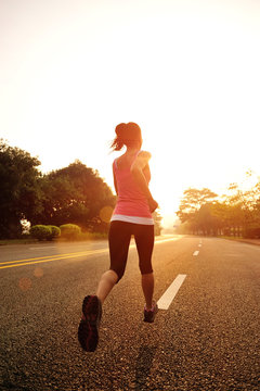 Runner athlete running on road