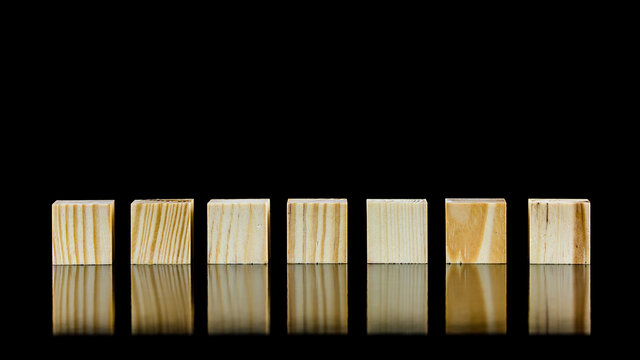 Seven blank wooden blocks