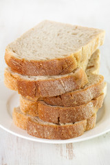 bread on plate on white background