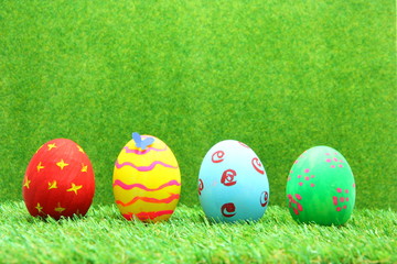 Fototapeta na wymiar Easter eggs on grass background