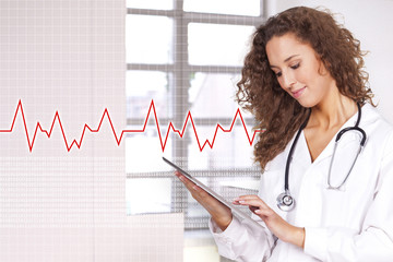 young and beautiful woman holding a portable computer