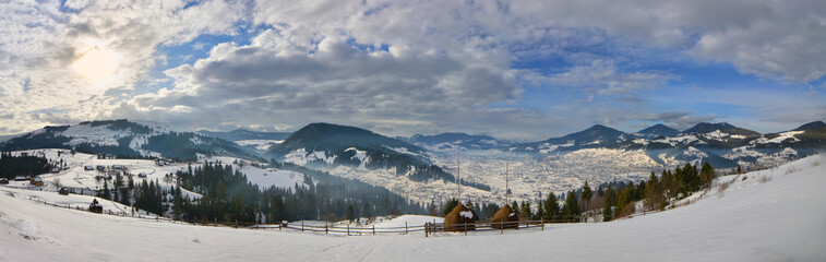 Panorama -haystack on the top of snow mountain and cloudy blue s