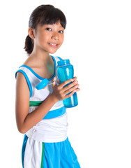 Young girl in sports attire with a bottle of water