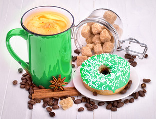 Tasty donut with a cup of coffee