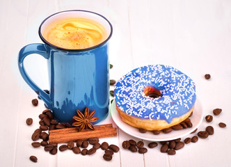 Tasty donut with a cup of coffee