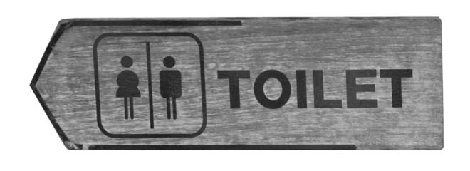 toilet plate sign on orange wall