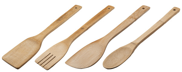 Wooden spoons on light gray background
