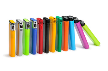 Colorful lighters on white background