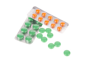 Pack of pills and opened blister isolated over white background