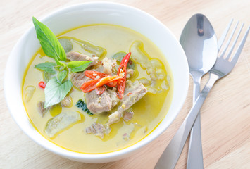 Green curry with pork   and fork spoon