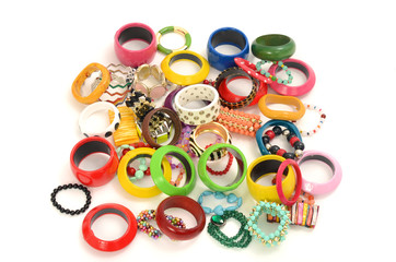 Close up on many, diversed colorful bracelets,beeing fashionable