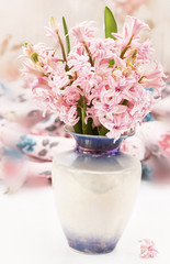 Fototapeta na wymiar bouquet of hyacinth in vase on the table