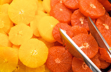 Slices of oranges and blood oranges at a buffet