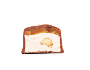 Slices bar of chocolate with peanuts.