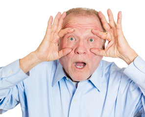 Senior old man keeping eyes open funny looking surprise 