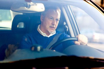 Bored man driving his car