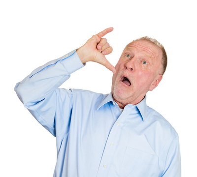 Old man showing a drunk hand sign gesture on white background 