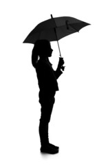 Silhouette of little girl with umbrella