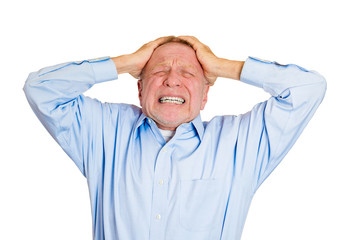 Stressed old man having bad day, headache