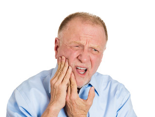 Senior man having bad tooth pain, sensitive teeth 